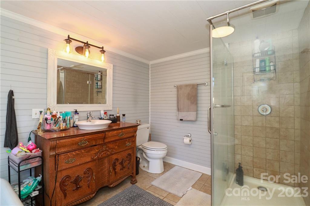 8689 Math Road Stanfield, NC 28163 - Photo 22 of 36 a bathroom with a sink mirror and toilet