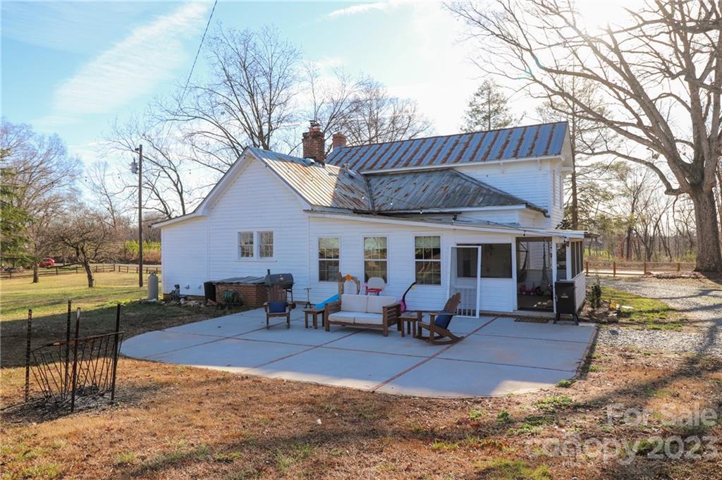 8689 Math Road Stanfield, NC 28163 - Photo 28 of 36 a view of a house with backyard and a tree