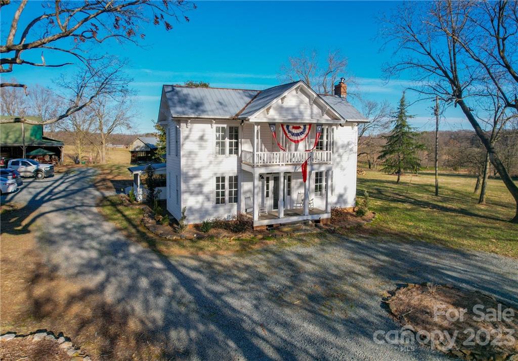 8689 Math Road Stanfield, NC 28163 - Photo 3 of 36 a view of a yard with wooden fence