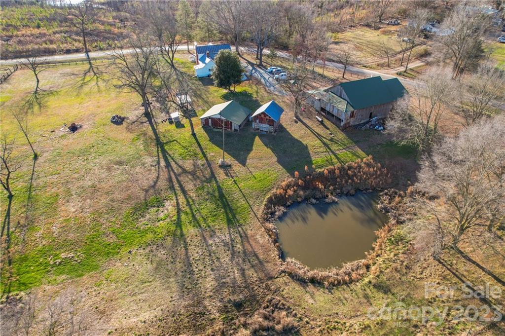 8689 Math Road Stanfield, NC 28163 - Photo 32 of 36 an aerial view of a house with a yard swimming pool and outdoor seating