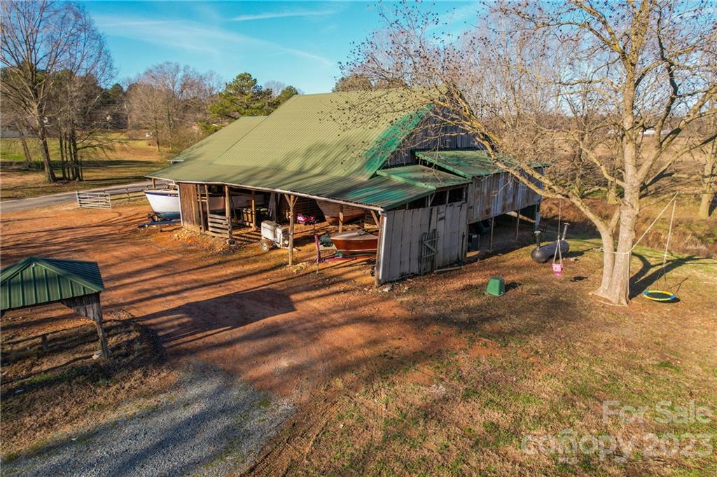 8689 Math Road Stanfield, NC 28163 - Photo 36 of 36 a view of a house with a yard