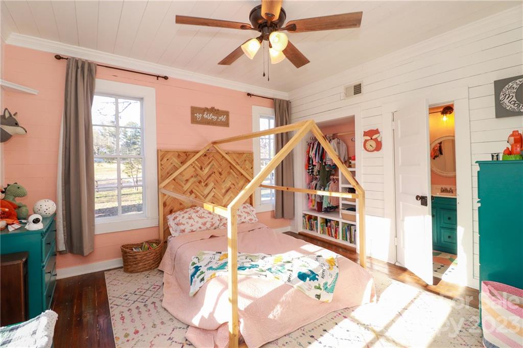 8689 Math Road Stanfield, NC 28163 - Photo 7 of 36 a living room with furniture and a chandelier