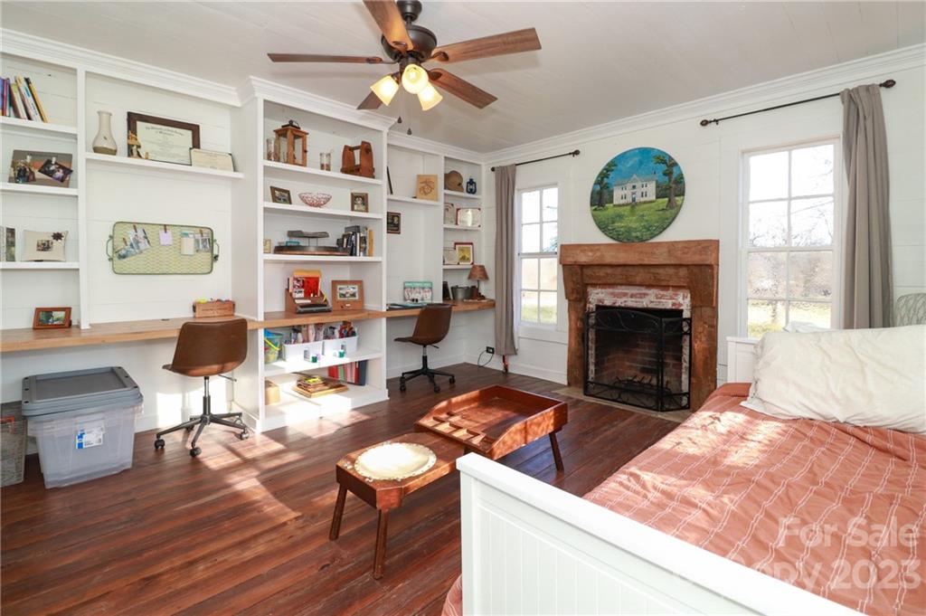 8689 Math Road Stanfield, NC 28163 - Photo 9 of 36 a living room with furniture and a fireplace
