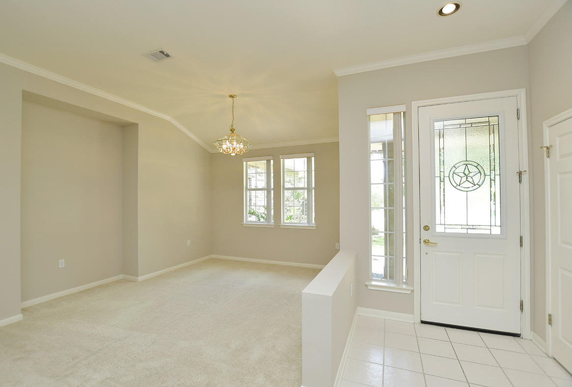 114 Lone Star Drive Georgetown, TX 78633 - Photo 6 of 30 Ten foot ceilings greet you in this Brazos plan. A leaded glass door and sidelight, allows natural light to flow into the entry..