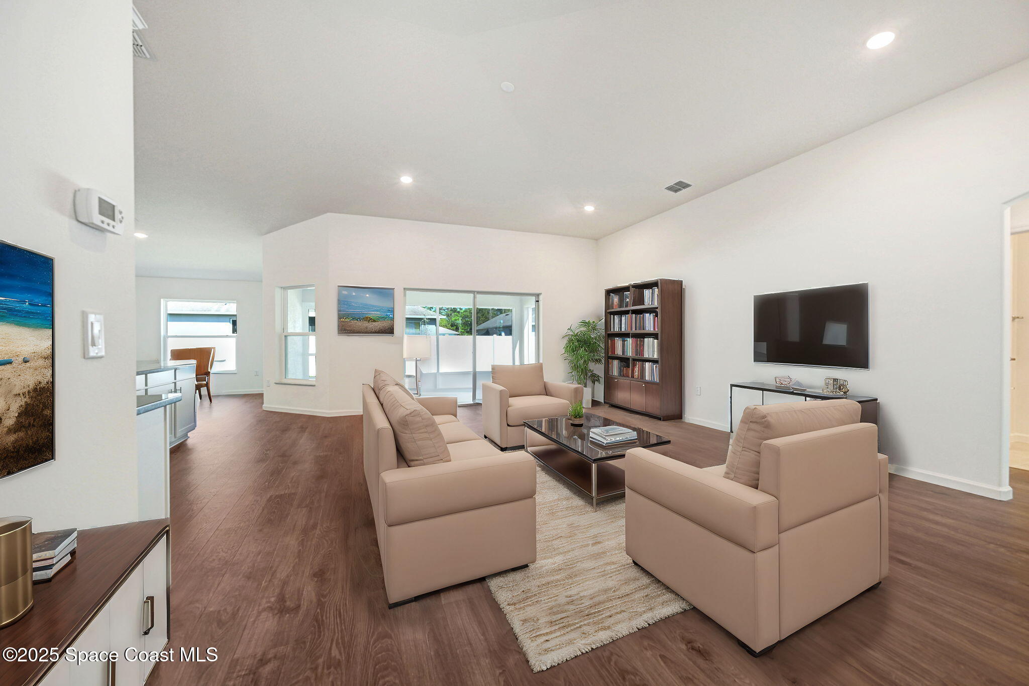 1089 Savery Road Palm Bay, FL 32908 - Photo 13 of 47 a living room with furniture and a flat screen tv