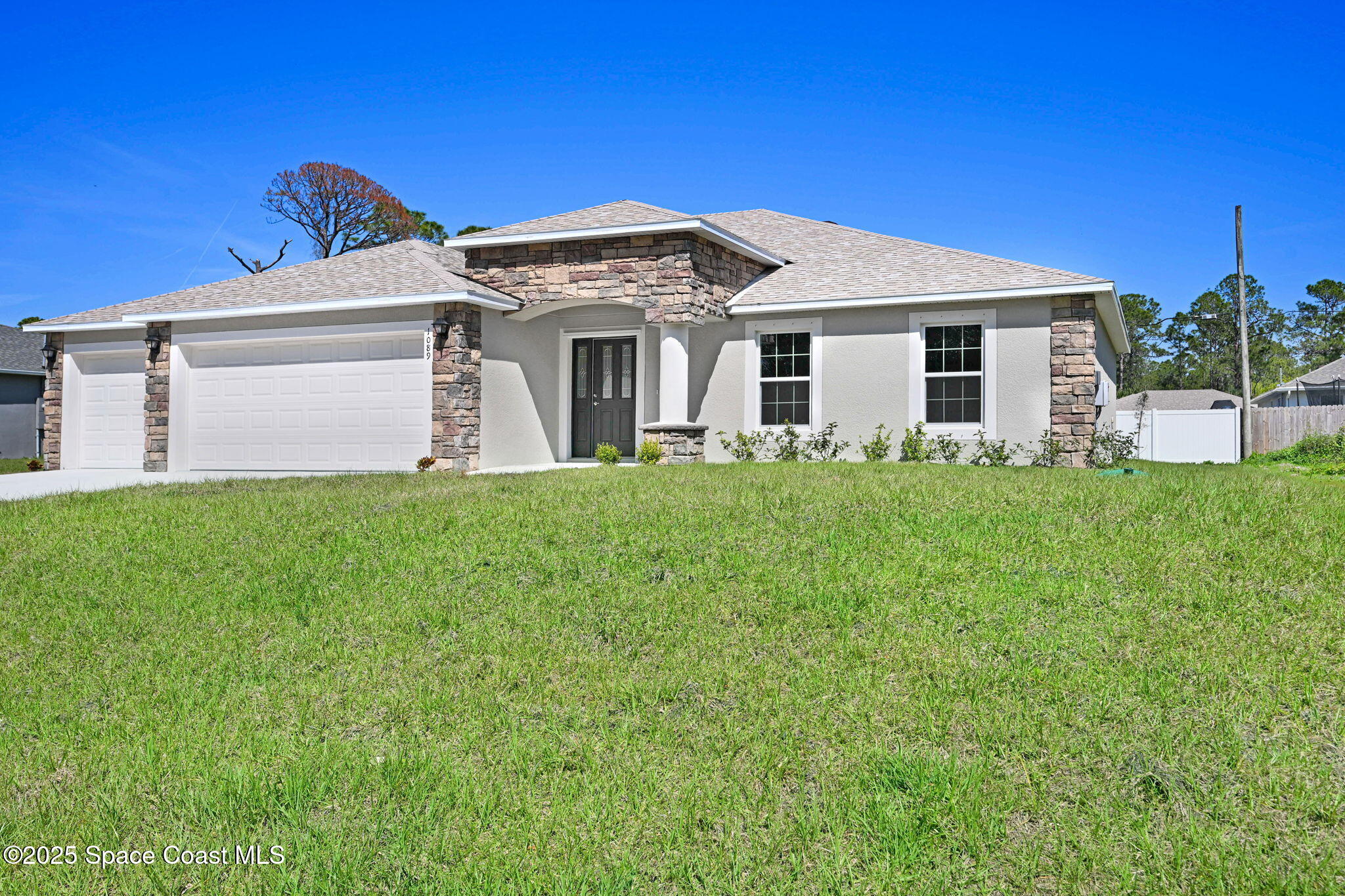 1089 Savery Road Palm Bay, FL 32908 - Photo 2 of 47 a view of a house with a yard