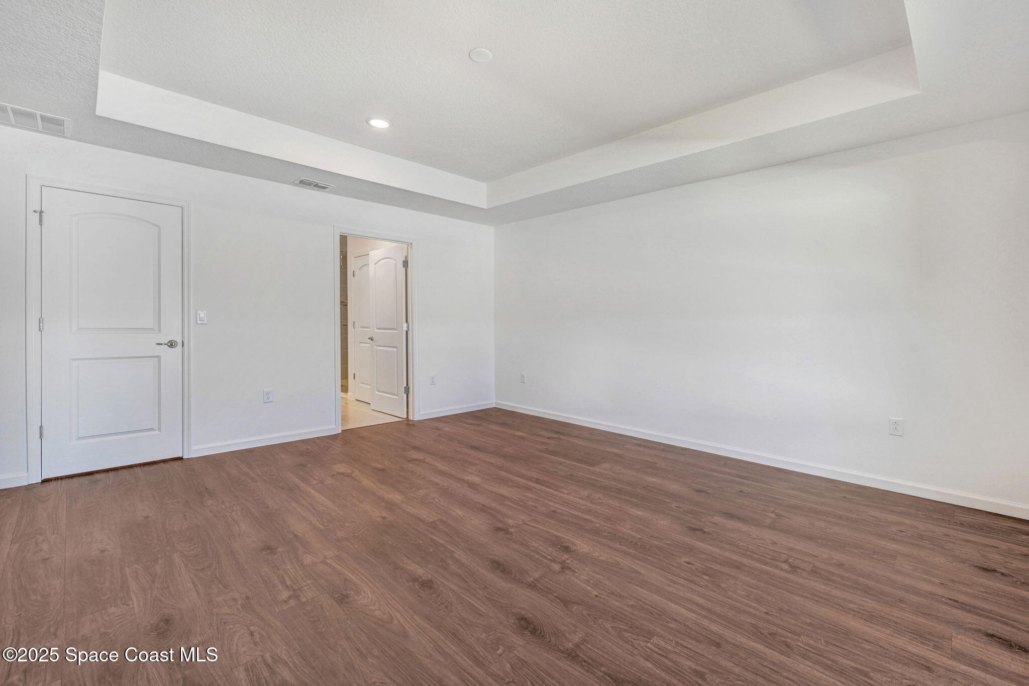 1089 Savery Road Palm Bay, FL 32908 - Photo 33 of 47 a view of an empty room and wooden floor