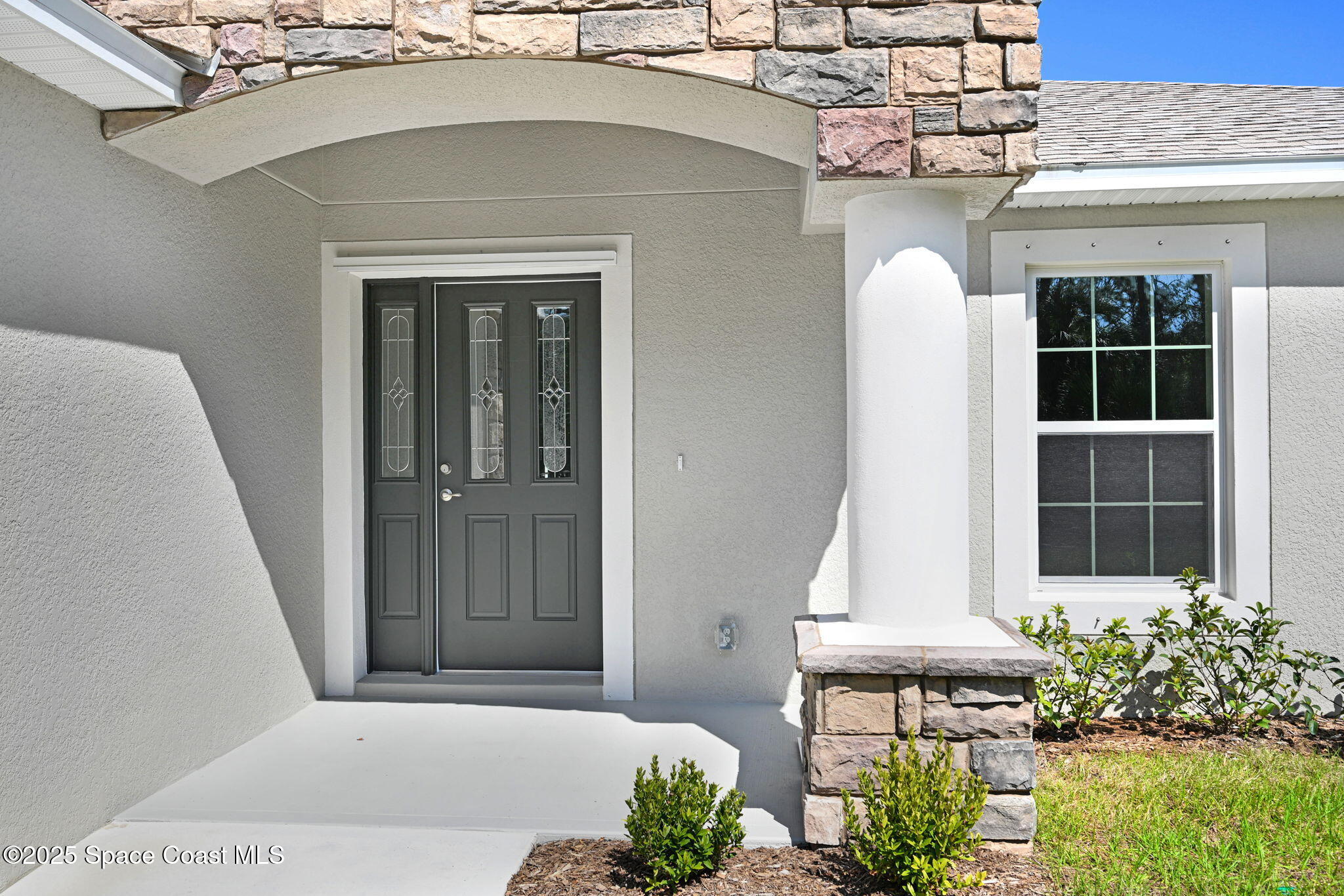 1089 Savery Road Palm Bay, FL 32908 - Photo 4 of 47 a front view of a house with a yard