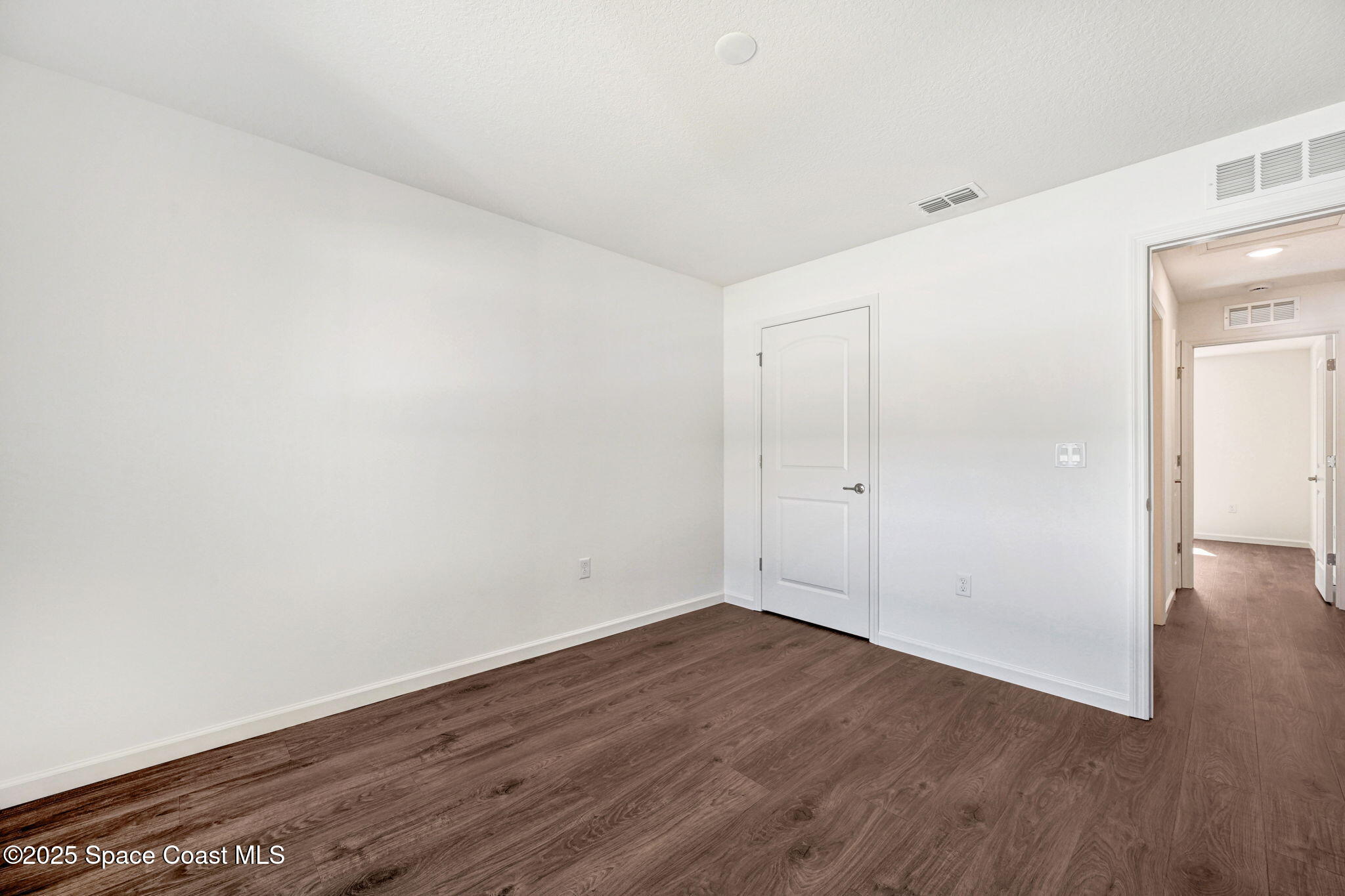 1089 Savery Road Palm Bay, FL 32908 - Photo 41 of 47 a view of room with wooden floor
