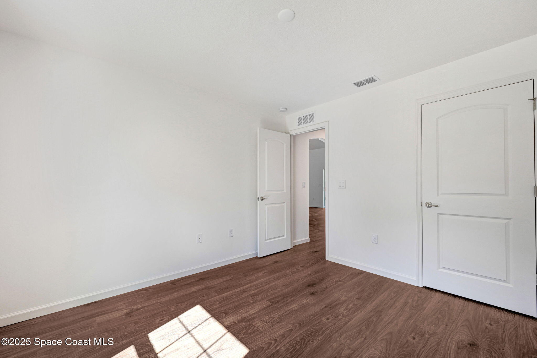 1089 Savery Road Palm Bay, FL 32908 - Photo 42 of 47 a view of empty room with wooden floor
