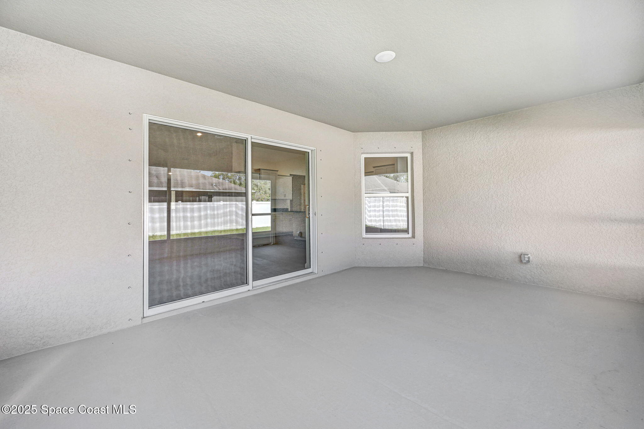 1089 Savery Road Palm Bay, FL 32908 - Photo 8 of 47 an empty room with windows