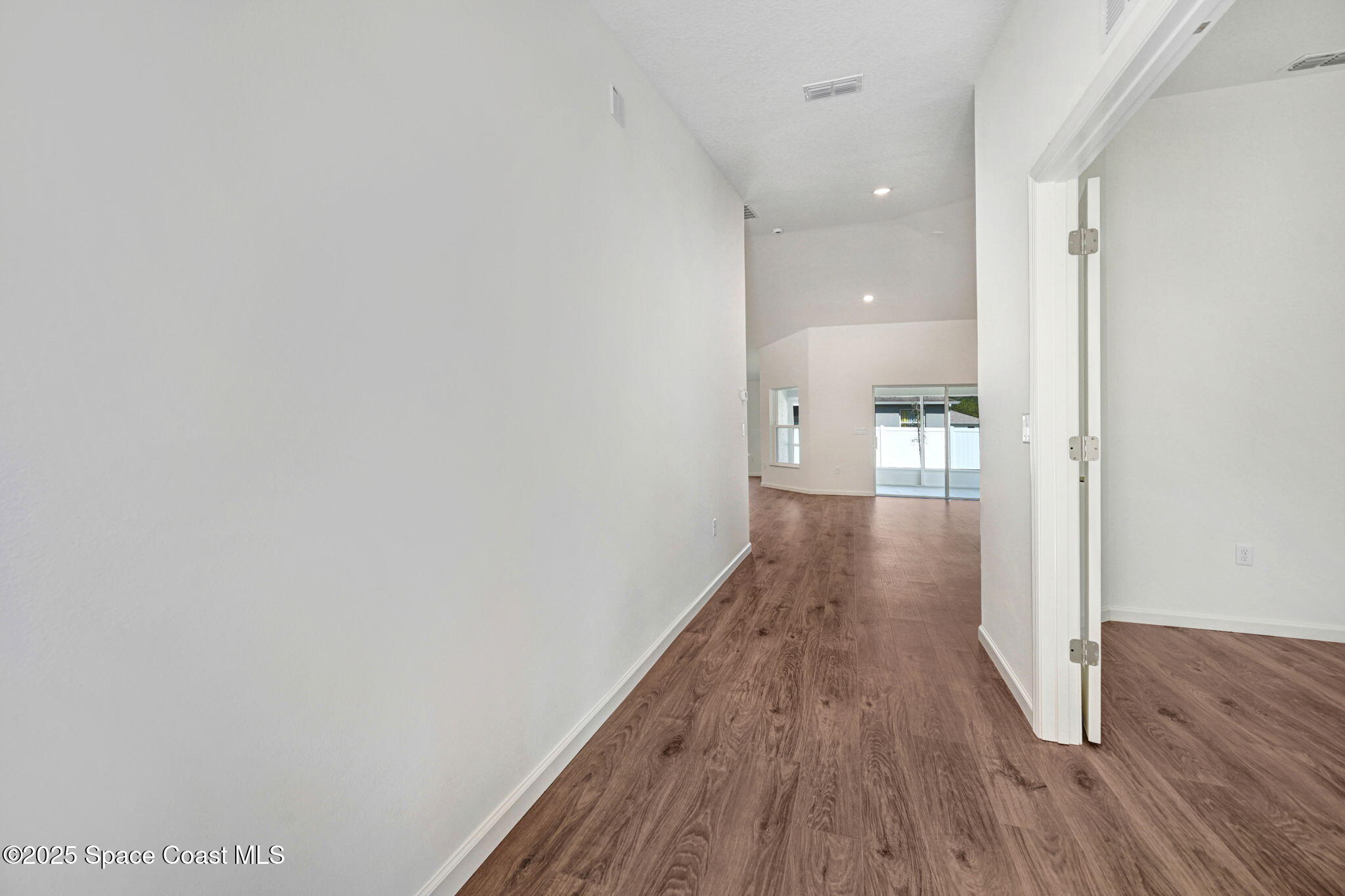 1089 Savery Road Palm Bay, FL 32908 - Photo 9 of 47 a view of a room with wooden floor