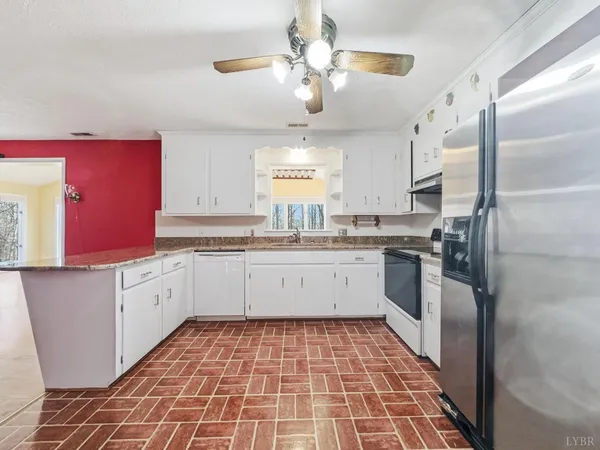 a view of a living room with wooden floor