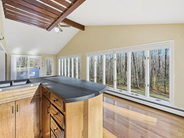 a view of a room with wooden floor