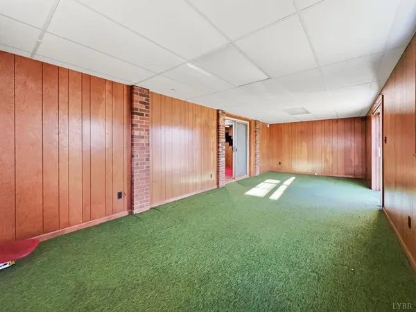a view of a room with wooden walls