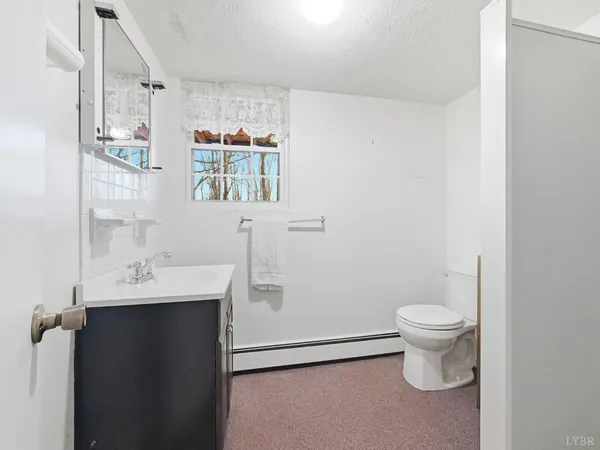 a view of a house with a wooden deck