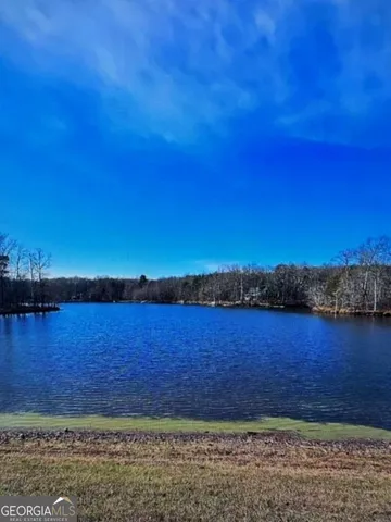 a view of lake with mountain in background