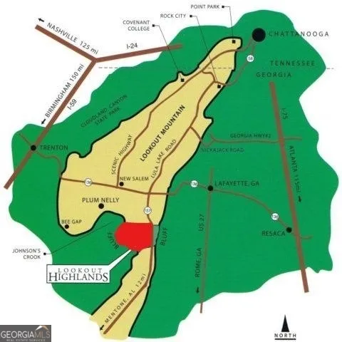 a view of a swimming pool with a garden and sitting area