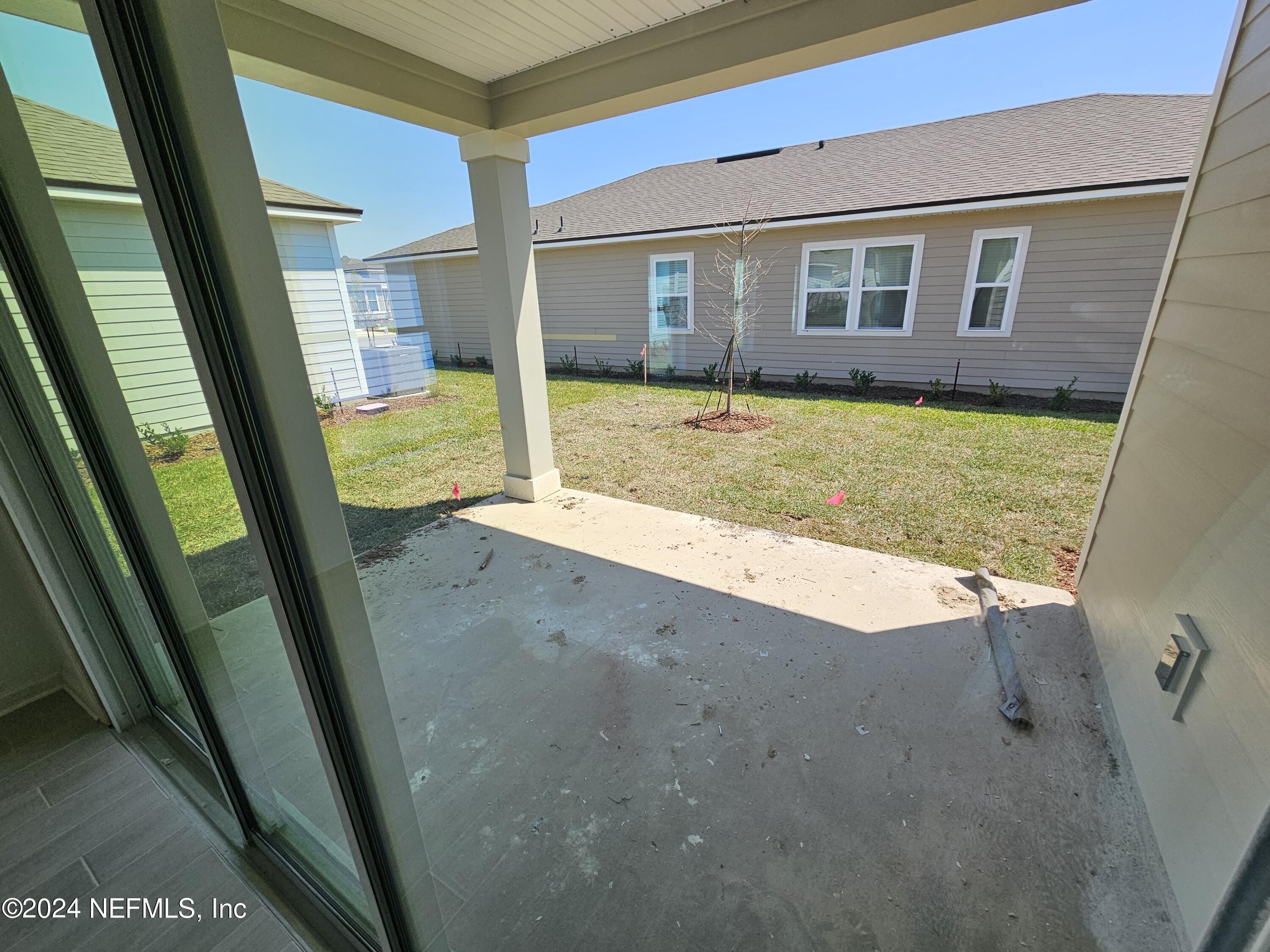 75232 Plumbago Trace Yulee, FL 32097 - Photo 11 of 79 a view of an house with a swimming pool