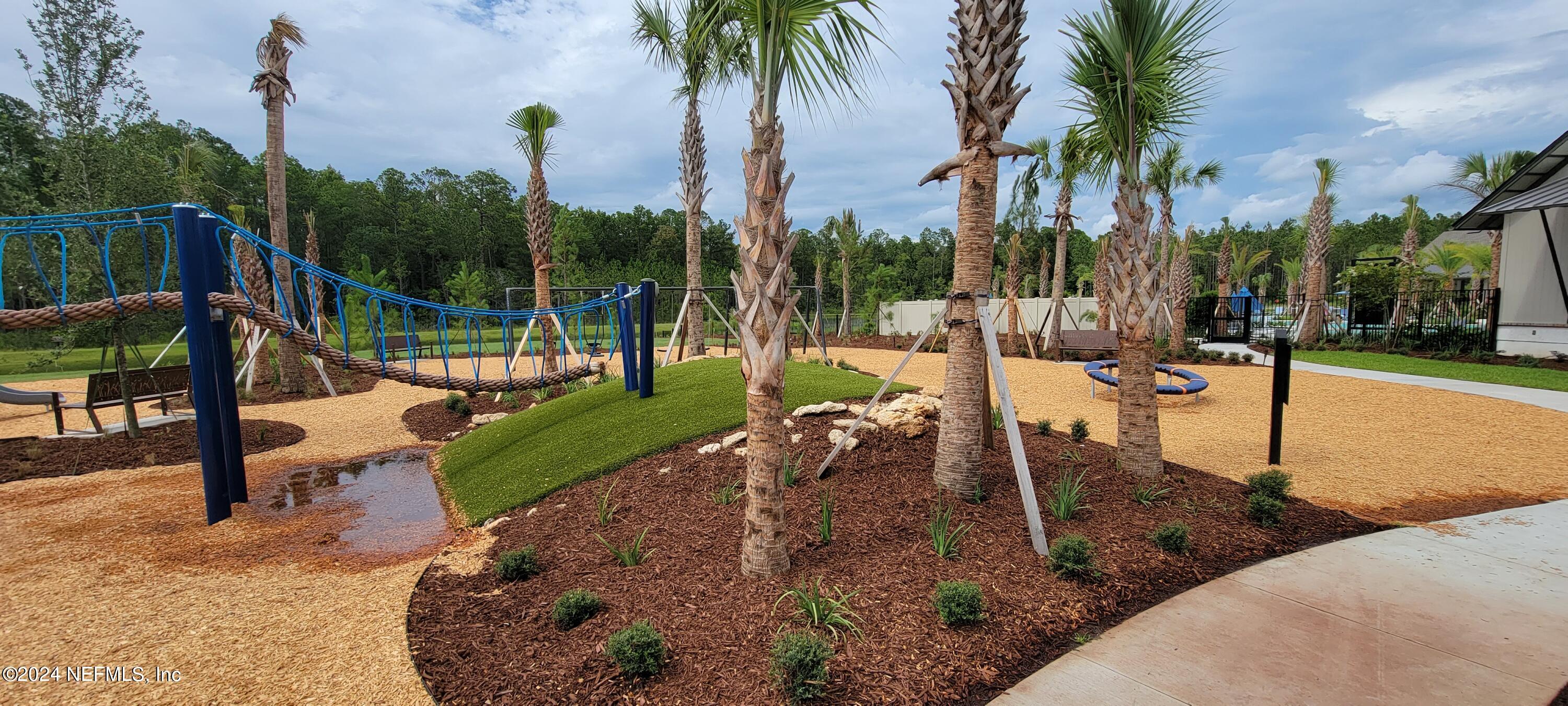 75232 Plumbago Trace Yulee, FL 32097 - Photo 56 of 79 a view of a park with swings