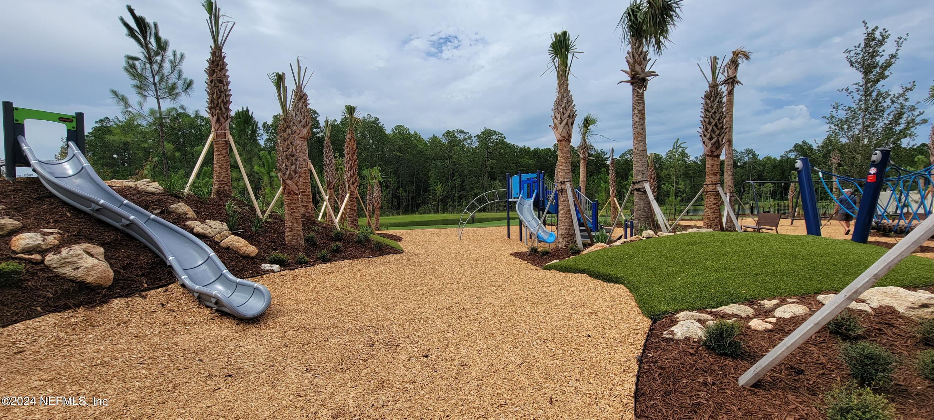 75232 Plumbago Trace Yulee, FL 32097 - Photo 58 of 79 a view of a park with swings
