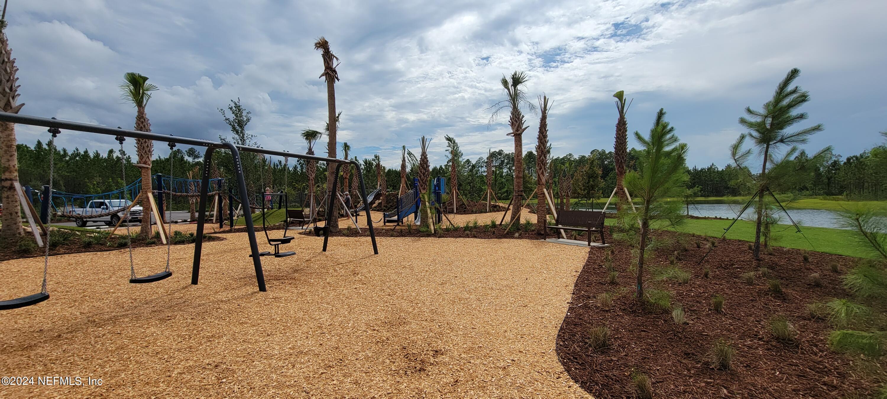 75232 Plumbago Trace Yulee, FL 32097 - Photo 69 of 79 a view of a park with swings