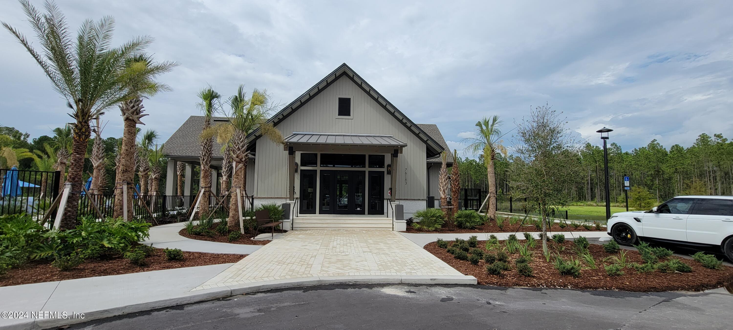 75232 Plumbago Trace Yulee, FL 32097 - Photo 73 of 79 a front view of a house with garden