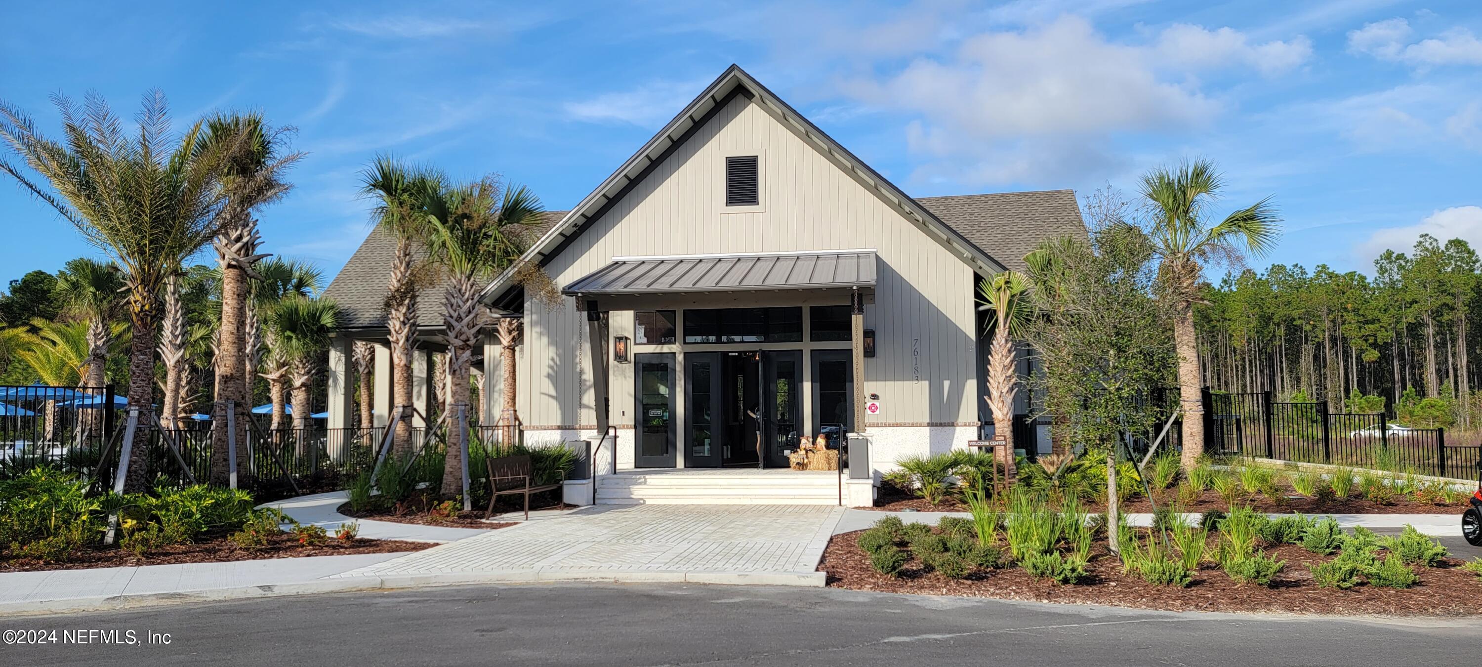 75232 Plumbago Trace Yulee, FL 32097 - Photo 77 of 79 a front view of a house with a garden