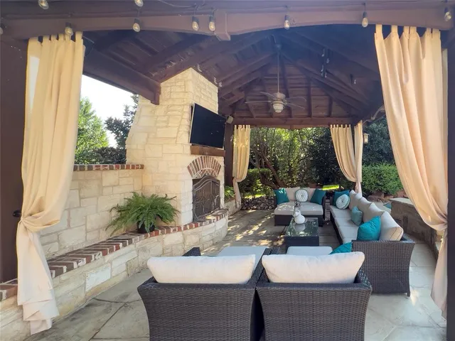 a outdoor space with patio the couches and a potted plant