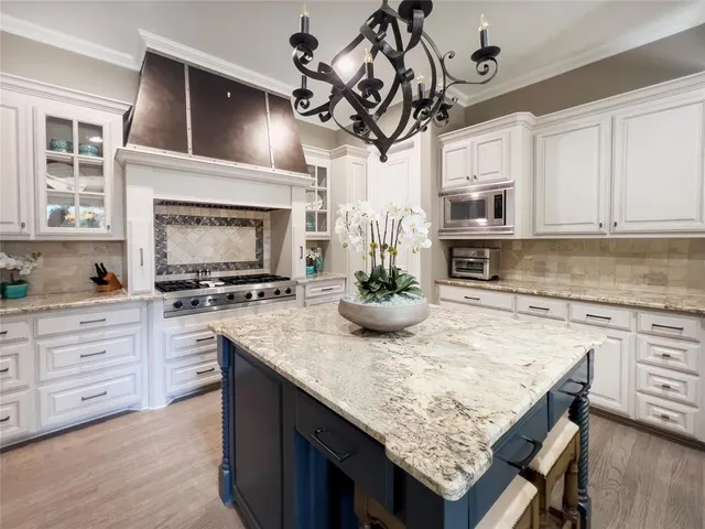 a kitchen with a counter space cabinets and appliances