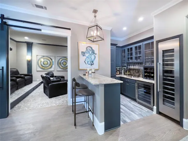 a kitchen with stainless steel appliances granite countertop a stove and cabinets