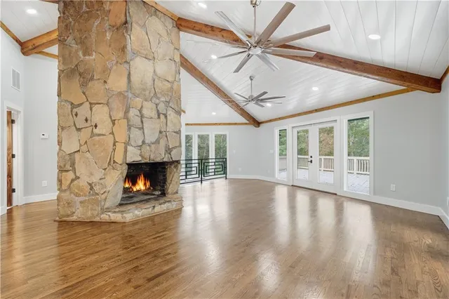 a kitchen with stainless steel appliances granite countertop a sink a refrigerator and a stove