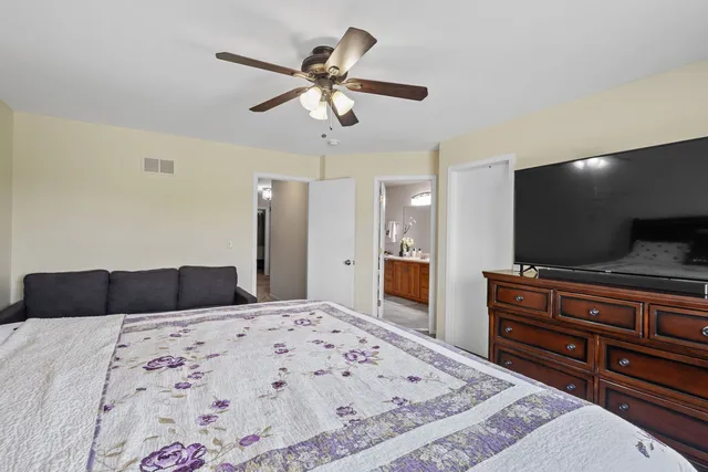 a bathroom with a toilet a sink and a mirror