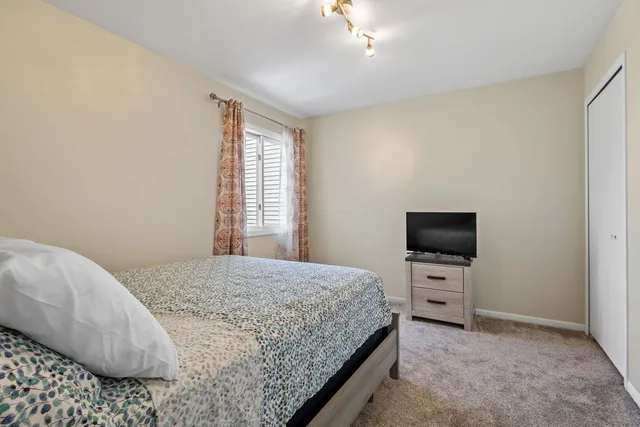 a bathroom with a sink toilet and a mirror