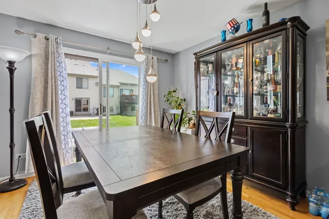 a kitchen with stainless steel appliances granite countertop a stove top oven a sink dishwasher and cabinets with wooden floor