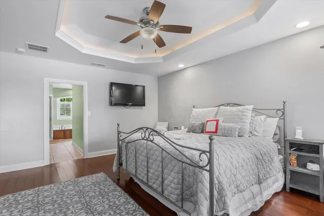 a spacious bathroom with a double vanity sink and a mirror