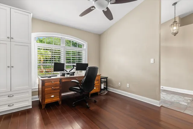 an empty room with cabinet and wooden floor