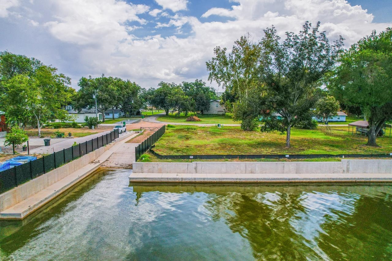 Lot 38 Harris Loop Kingsland, TX 78639 - Photo 3 of 7 a view of a swimming pool with a yard