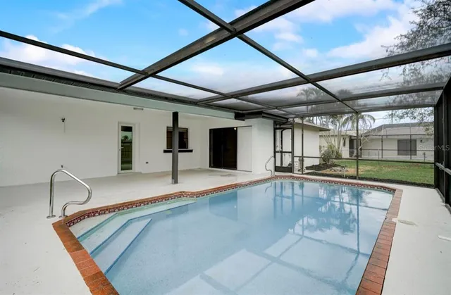 a view of a kitchen with a sink and cabinets