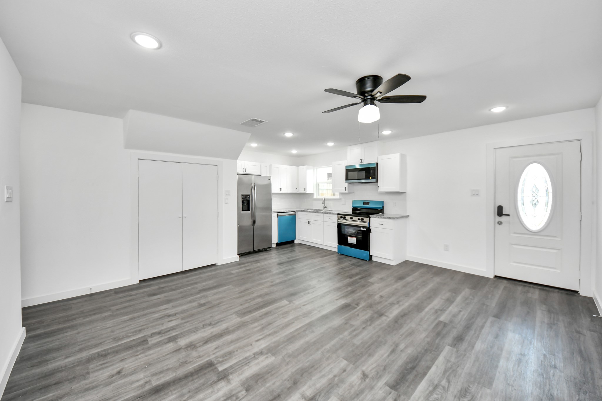 2310 Wavell Street, Unit B Houston, TX 77088 - Photo 12 of 37 a view of a kitchen with a microwave and a dishwasher