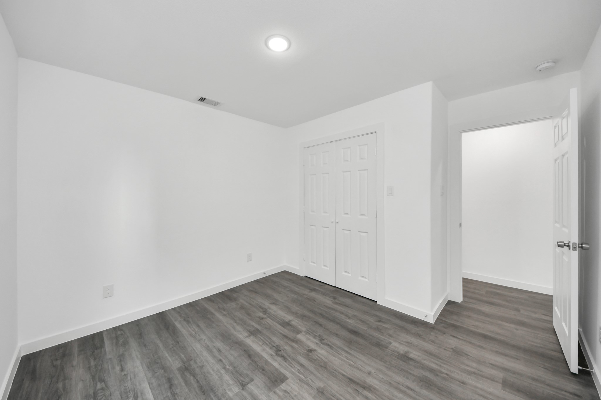 2310 Wavell Street, Unit B Houston, TX 77088 - Photo 19 of 37 a view of an empty room with wooden floor
