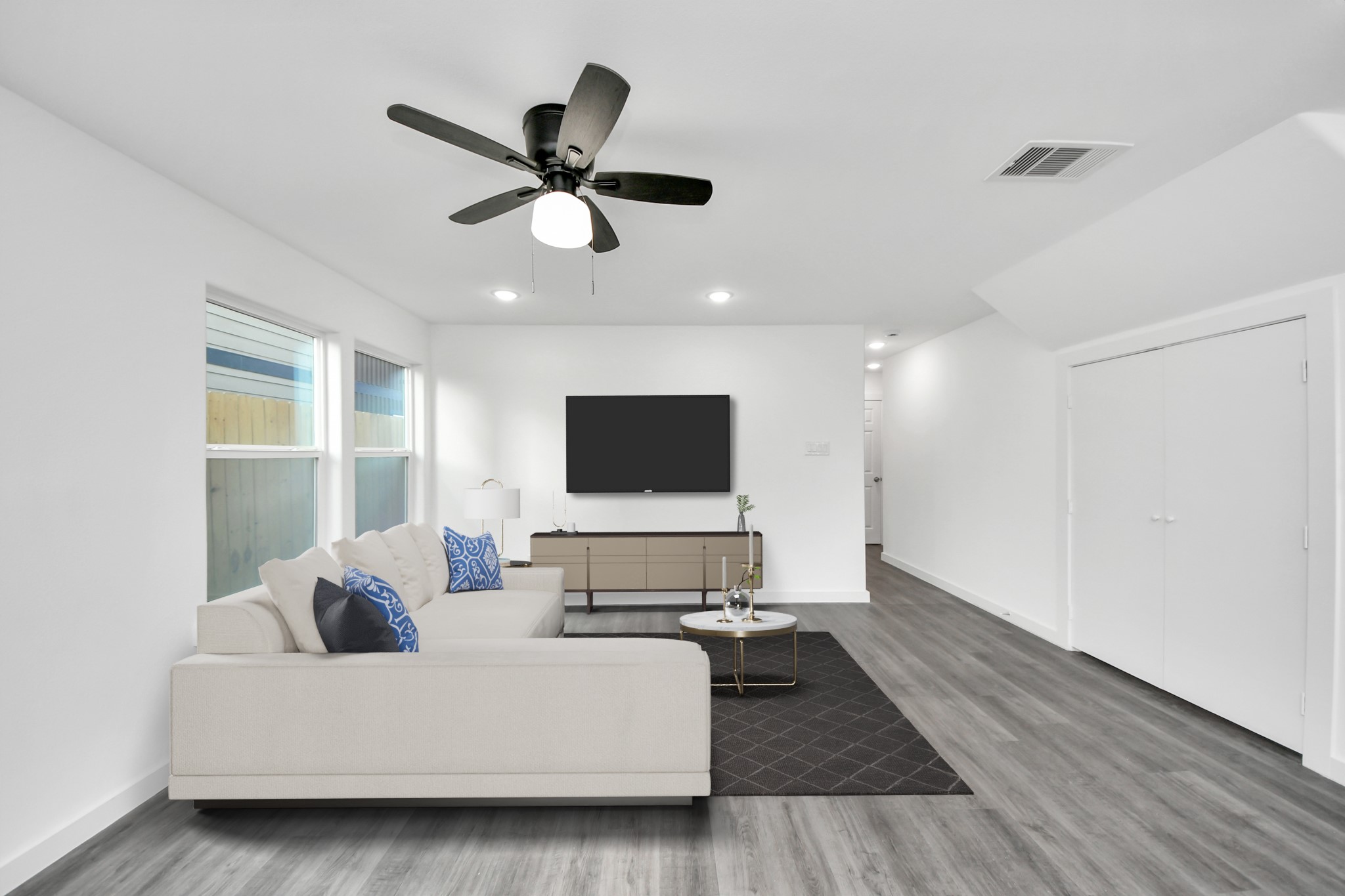 2310 Wavell Street, Unit B Houston, TX 77088 - Photo 7 of 37 a living room with furniture and a flat screen tv
