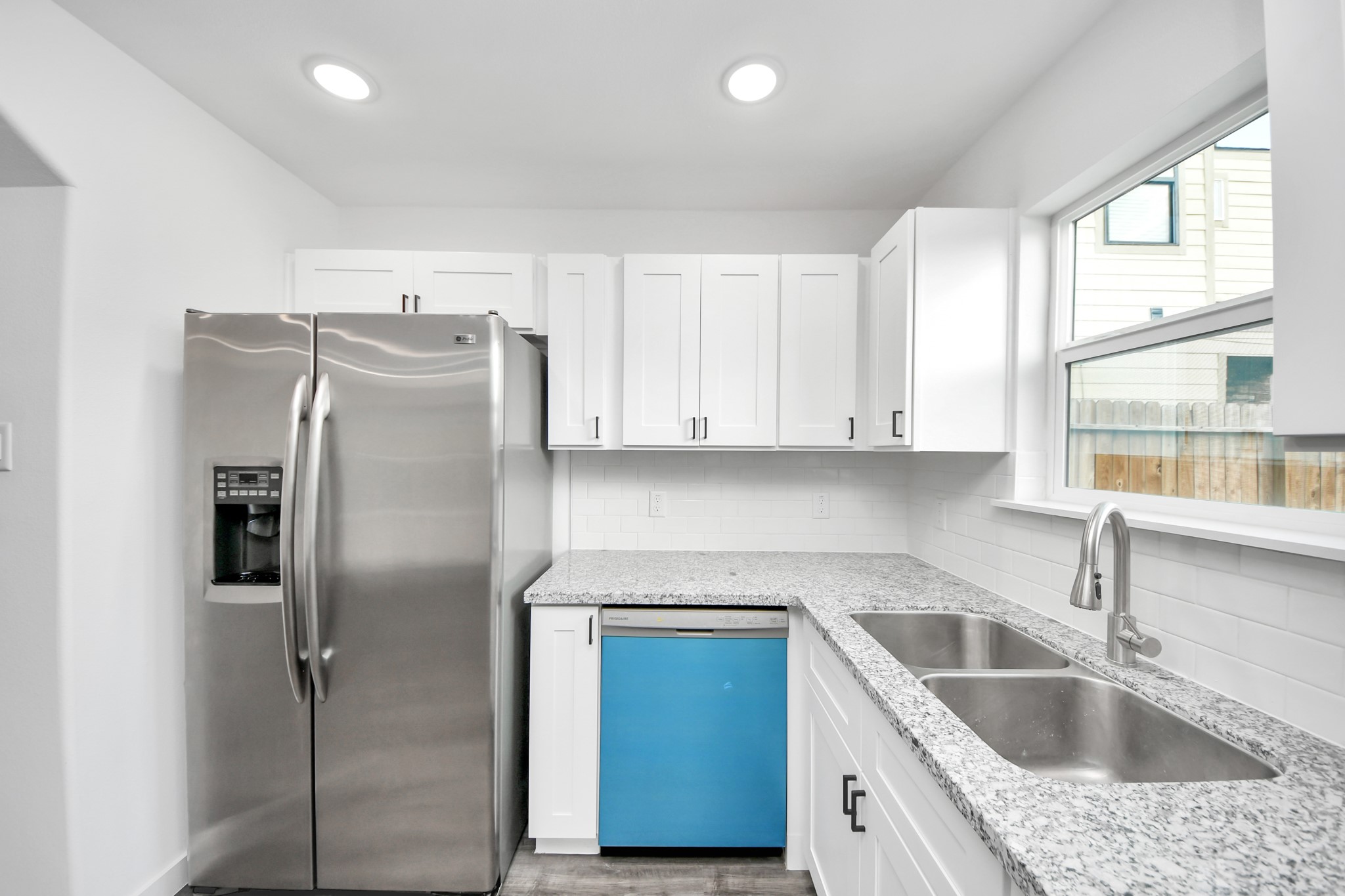 2310 Wavell Street, Unit B Houston, TX 77088 - Photo 10 of 37 a kitchen with granite countertop a sink and refrigerator