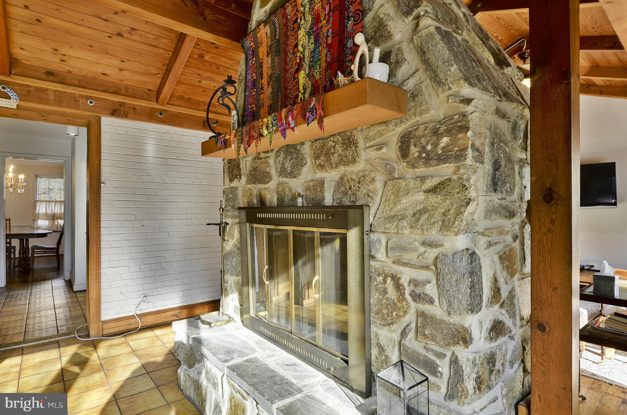9704 Elrod Road Kensington, MD 20895 - Photo 6 of 30 Dual Sided Stone Fireplace