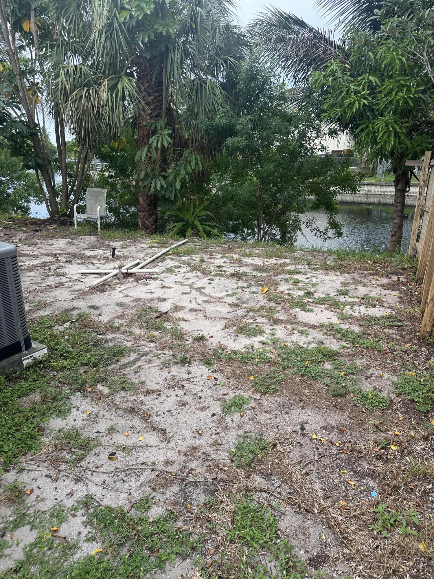 6504 Harbour Road North Lauderdale, FL 33068 - Photo 14 of 15 a backyard of a house with lots of green space