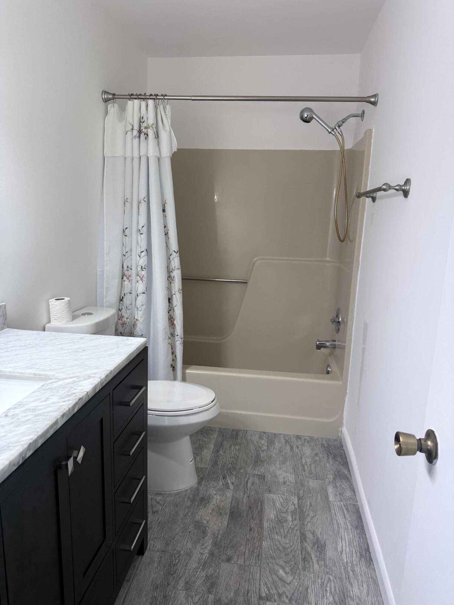 6504 Harbour Road North Lauderdale, FL 33068 - Photo 6 of 15 a bathroom with a granite countertop sink toilet and shower