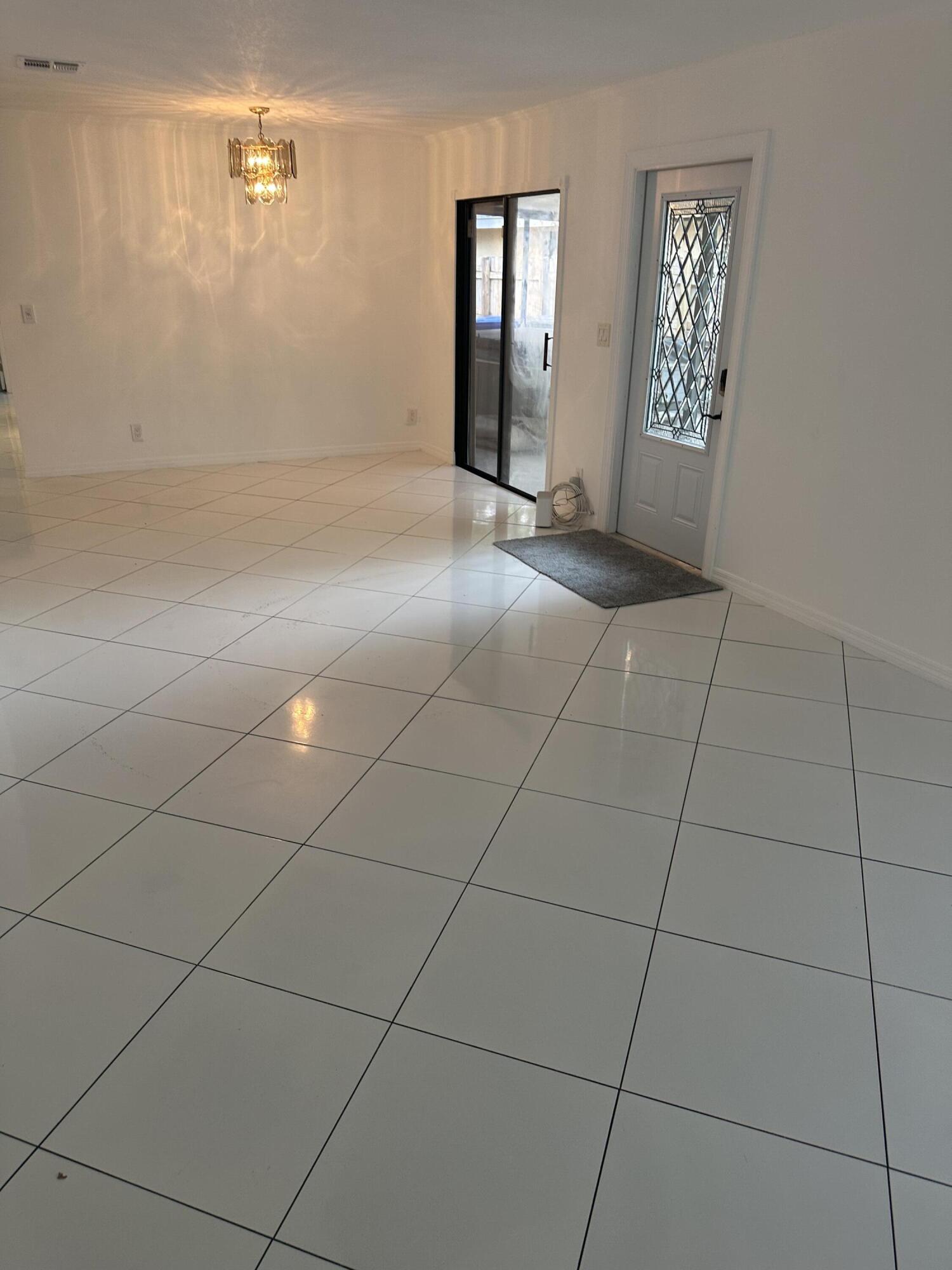6504 Harbour Road North Lauderdale, FL 33068 - Photo 8 of 15 a view of an empty room with window and wooden floor