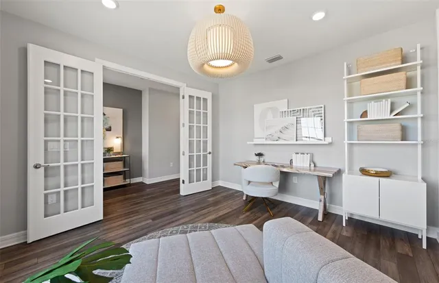 a bedroom with furniture and a window