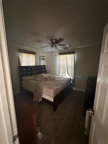 a bedroom with a bed and window