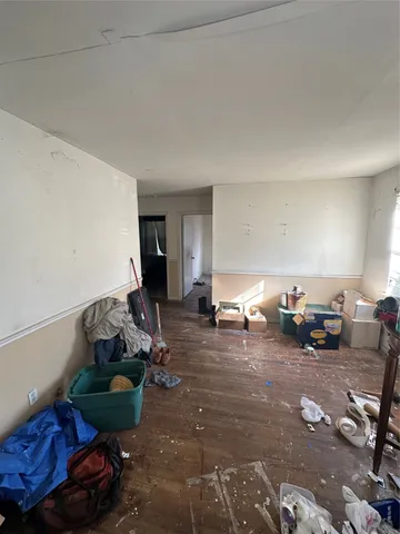 a living room with furniture and a lamp